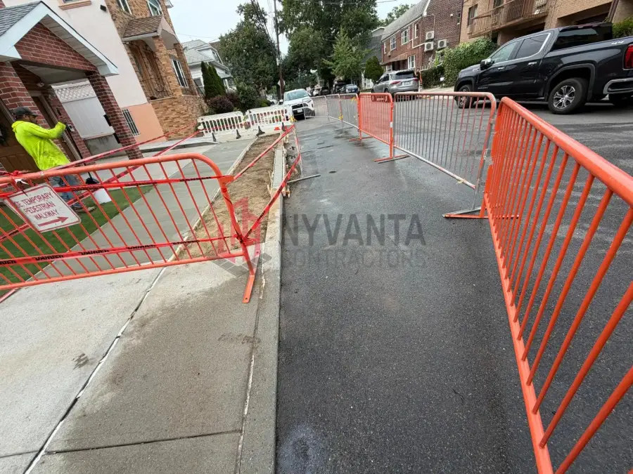 Barricaded sidewalk work zone outside a residential property on 168th St in Flushing
