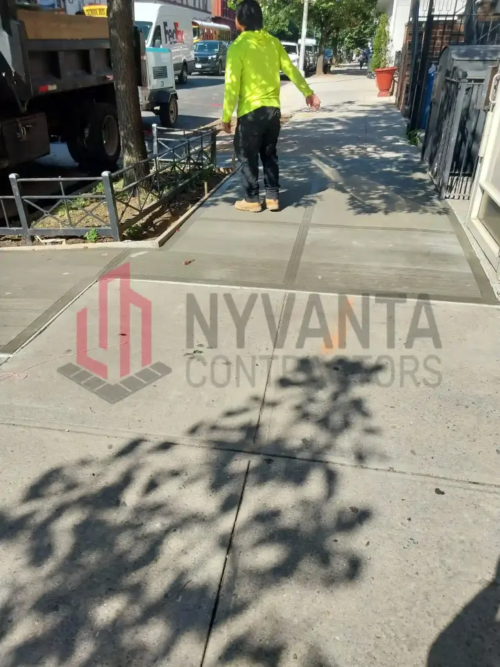 Completed tree-root sidewalk repair outside a mixed-use building at 326 Atlantic Ave in Downtown Brooklyn